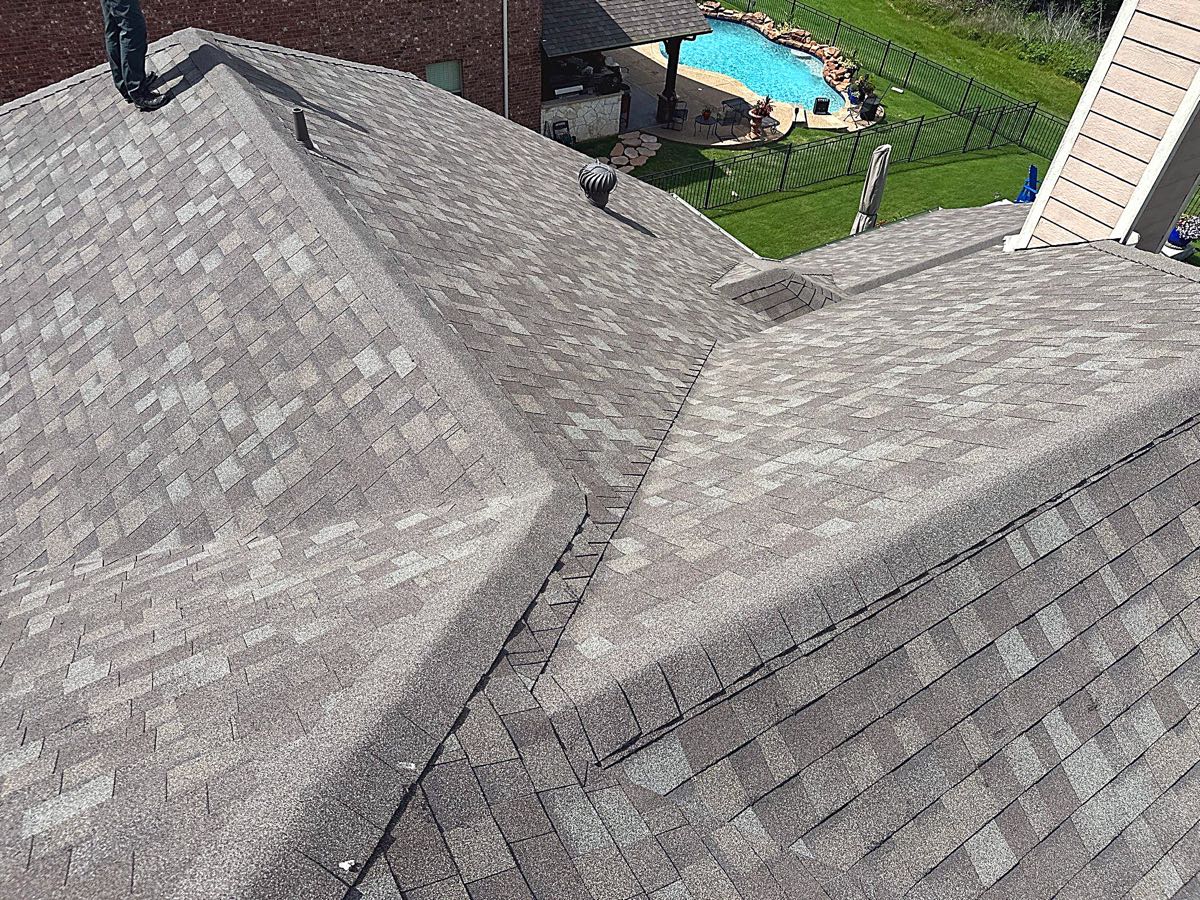 New asphalt shingle roof installed by Benchmark Roofing after a hail claim on a Garland, TX home