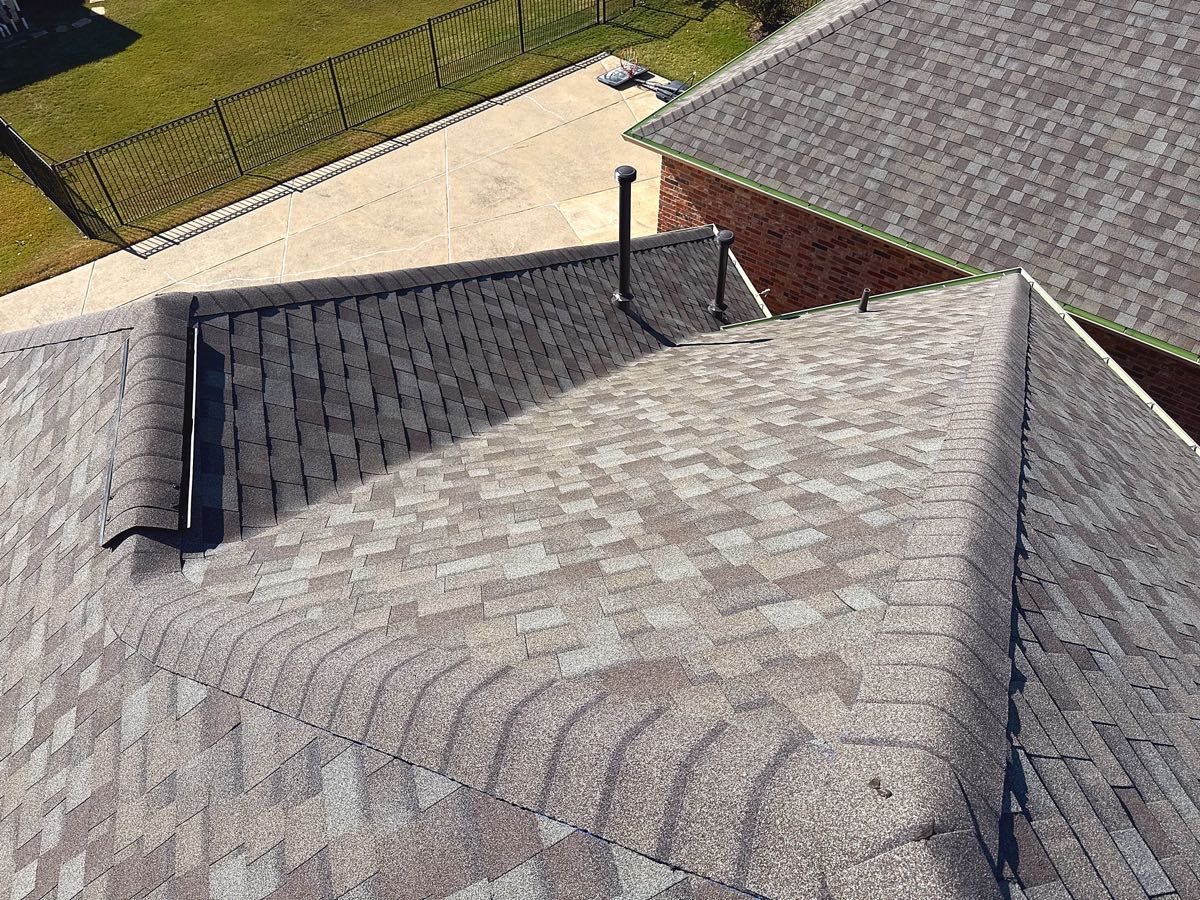 Aerial view of a newly replaced architectural shingle roof, the kind of full tear-off common on older homes in Mesquite's 75149 and 75150 ZIP codes