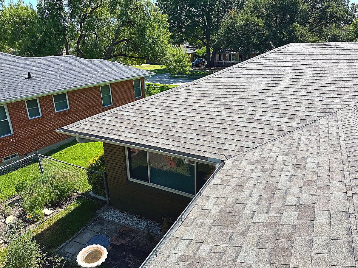 Close-up of new architectural shingles on a Garland, TX roof chosen to stand up to Texas heat and hail