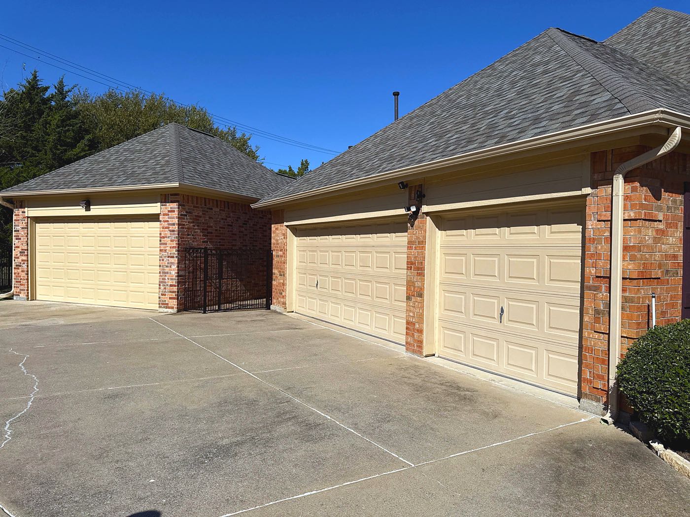 Completed architectural shingle roof replacement on a Garland home by Benchmark Roofing and Construction