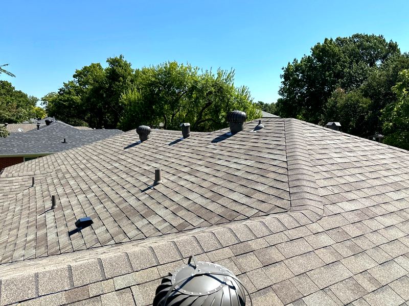 Full residential reroof with new underlayment and shingles by Benchmark Roofing