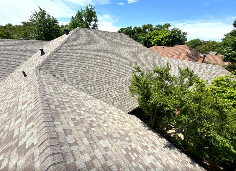 New architectural asphalt shingle roof installed by Benchmark Roofing in the Dallas–Garland area