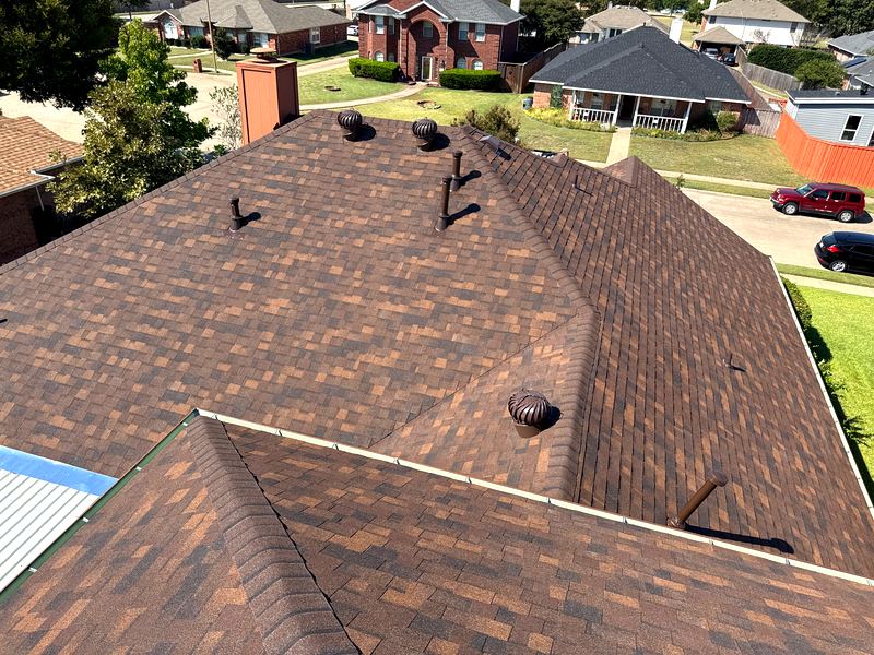 Roof tear-off and replacement project by Benchmark Roofing and Construction