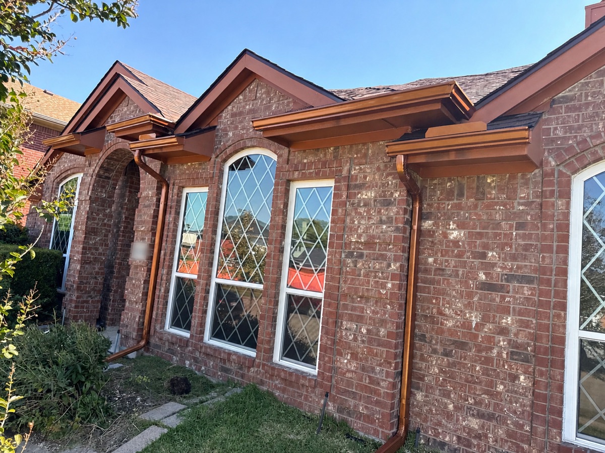 Seamless aluminum gutter installation on a residential home
