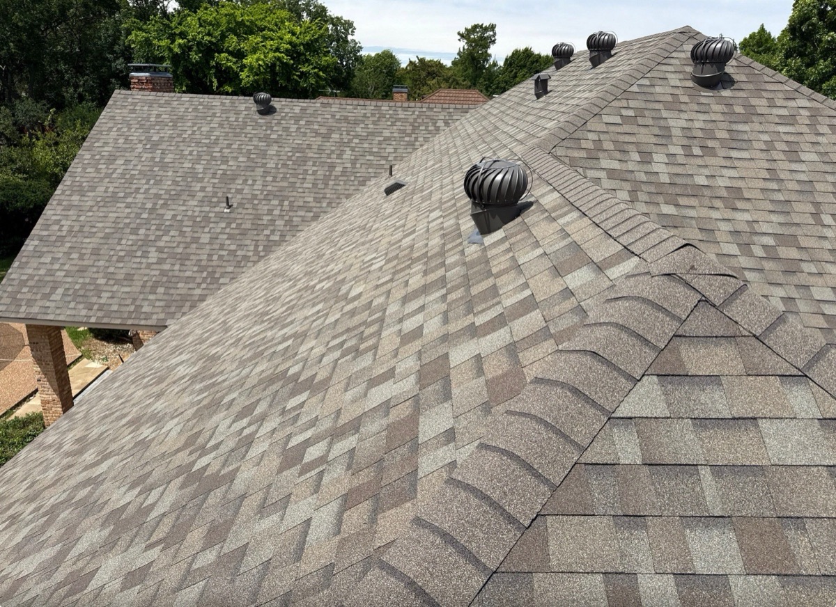 Benchmark Roofing crew installing a new asphalt shingle roof